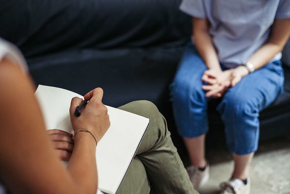 Closeup of two people in therapy session